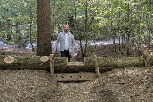 One of the leaky dams in Park Wood, Ruislip: a felled trunk with a notched timber board beneath it to slow water after heavy rain
